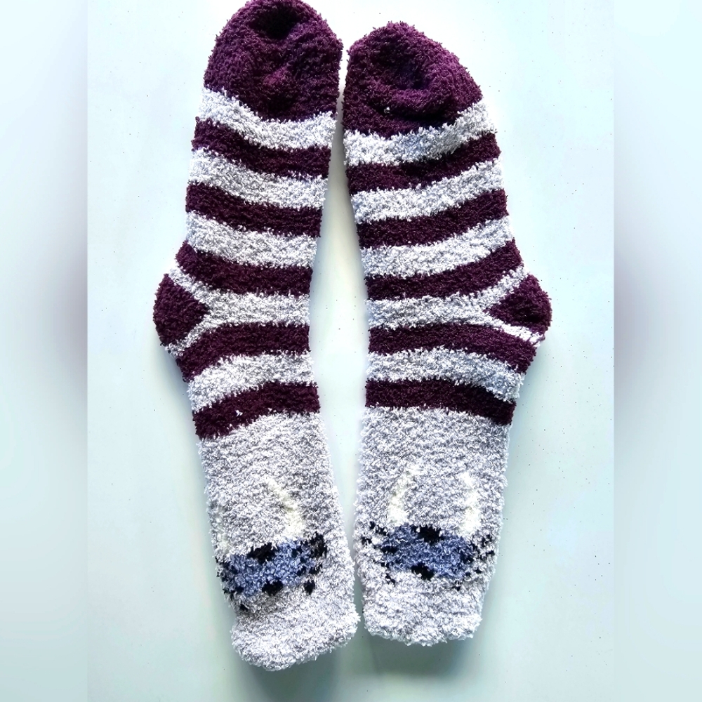 Fuzzy purple/white striped socks. Never used